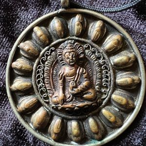 Buddha pendant in chord  purchased in Cambodia